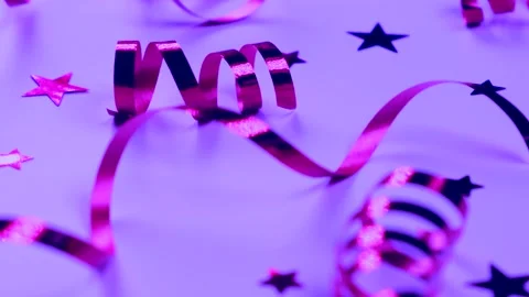 Festive background with pink serpentine and confetti stars decorative, Stock Footage 231481582