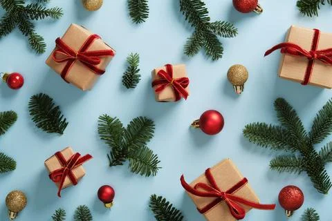Festive background with small gift boxes wrapped in kraft paper, with bows .. Stock Photos