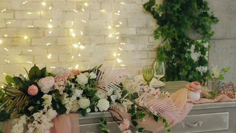 The festive banquet table is decorated with a large number of fresh flowers Stock Footage 154893976