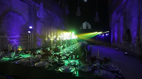 Festive banquet table, restaurant in colored light Stock Footage 137540563