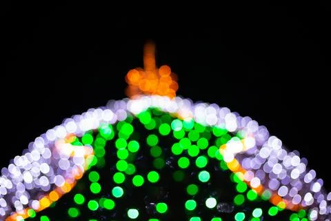 Festive blurred backdrop of ball in the shape of a christmas tree Stock Photos