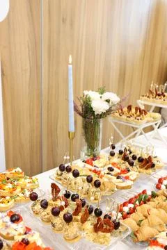 Festive buffet featuring assorted canapes, open sandwiches, cheese appetizers 스톡 사진