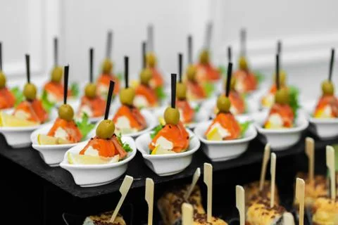 Festive buffet table with many snacks and appetizers Stock Photos