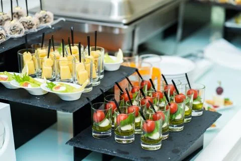 Festive buffet table with many snacks and appetizers Stock Photos