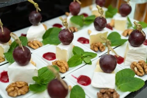 Festive buffet table with many snacks and appetizers Stock Photos