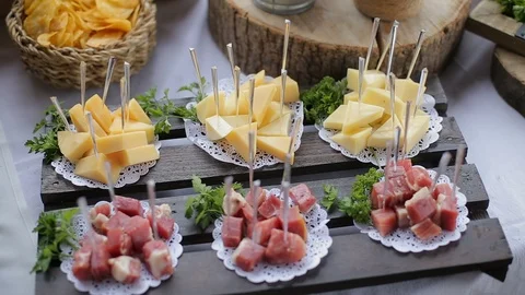 Festive buffet table with meat and cheese appetizer Stock Footage 99740304