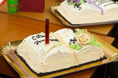 Festive cake with a candle Stock Photos