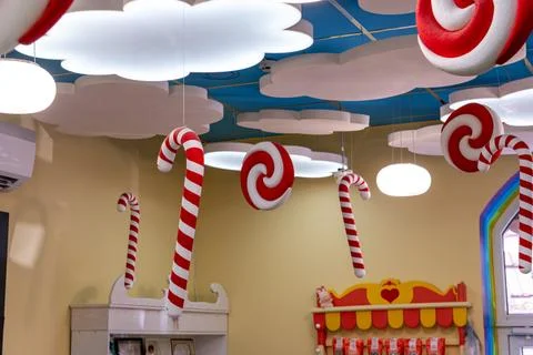 Festive Candy Land Theme Interior Decoration with Hanging Candy Canes and C.. Fotos Stock
