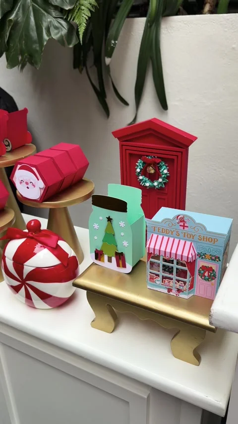 Festive Candy Table with Santa and Christmas Tree Gift Boxes Stock Footage 327398508