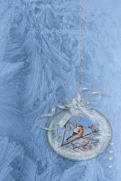 Festive card background with icy pattern on glass and Christmas Ornaments Stock Photos