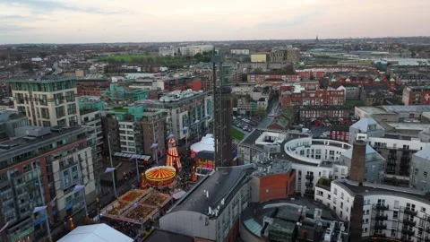 Festive Carnival in Dublin's Smithfield with Vibrant Cityscape Stock Footage 332445574