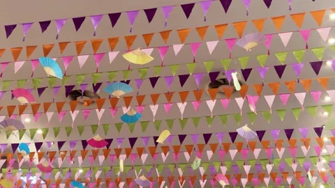 Festive ceiling decorated with flags and paper fans Stock Footage 346709991