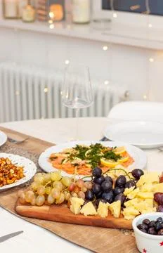 Festive celebration table decorated with white and golden tablecloth, with .. Stock Photos