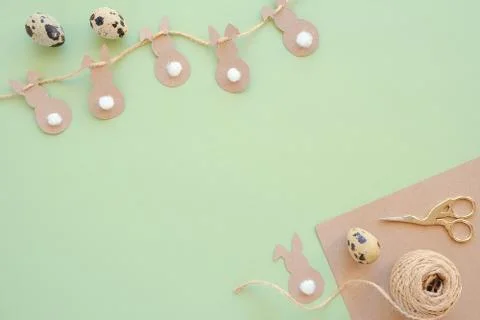 Festive, children 's or Easter decor. Garland of easter bunny and kraft paper Stock Photos