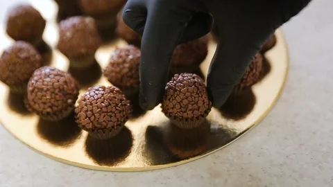 Festive chocolate cake pops with sprinkles close-up on the table Stock Footage 102368815