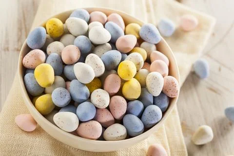 Festive Chocolate Easter Candy Eggs in a Bowl Stock Photos