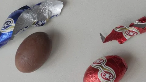 Festive Chocolate Easter Eggs with Colorful Foil Wrappers on Display Stock Footage 331907016