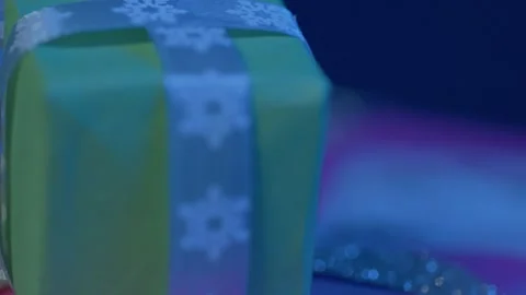 Festive Christmas Gift Close-up with Snowflake Ribbon Stock Footage 325411288