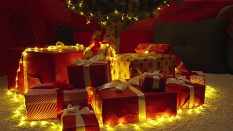 This festive Christmas scene features wrapped gifts and a towering tree Stock Footage 289733725