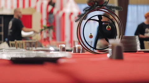 Festive christmas table with red tablecloth, large banquet hall Stock Footage 142197622