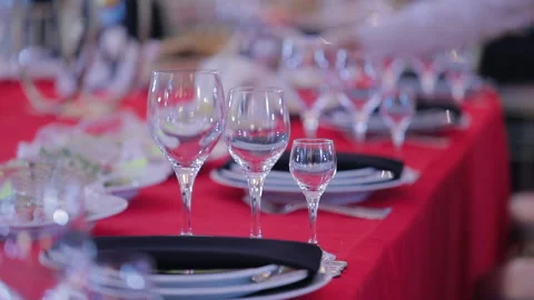 Festive christmas table with red tablecloth, large banquet hall Stock Footage 142198286