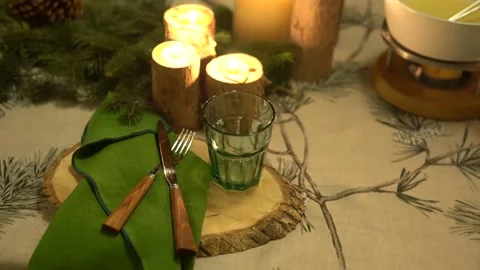 Festive Christmas table setting Spruce twigs, pumpkins, candles, romantic mood. Stock Footage 145331001
