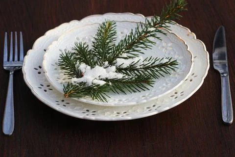 Festive Christmas table setting, table decoration with fir branches, wooden.. Stock Photos