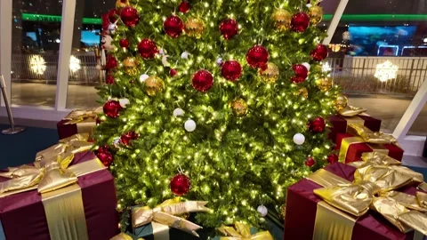 Festive Christmas Tree with Gold-Wrapped Presents and Holiday Decorations Stock Footage 293958586