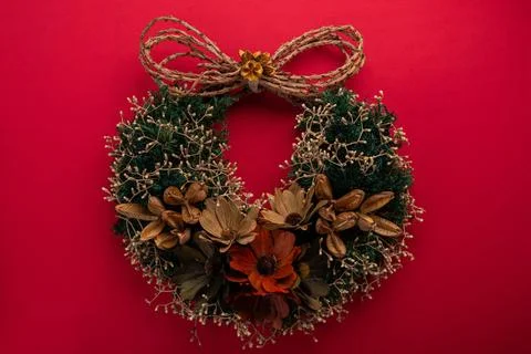 Festive christmas wreath with rustic bow Stock Photos