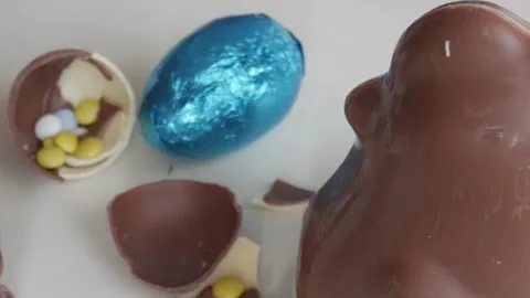Festive Close-Up of Easter Chocolate Eggs and Bright Candies Stock Footage 332944377