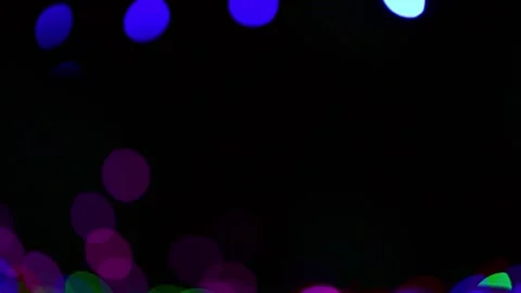 Festive colored defocus lights on dark background 動画素材 235653101