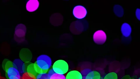 Festive colored defocus lights on dark background 動画素材 238030188
