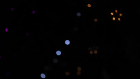 Festive colored defocus lights on dark background Vídeo Stock 242243370