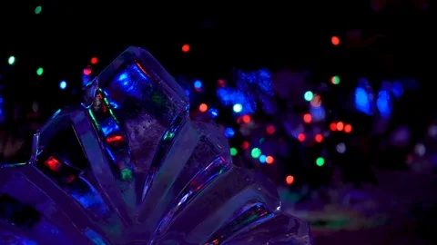 Festive colored lights at night with a blurred background. Stock Footage 99867197