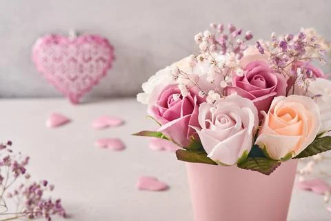 Festive composition with beautiful delicate roses flowers in pink round box o Stock Photos