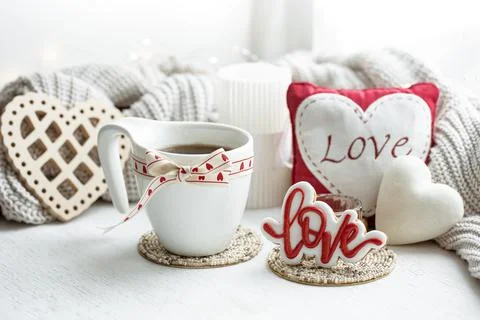 Festive composition with a cup and decor details for Valentine's Day. Stock Photos