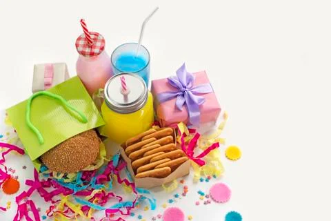 Festive composition drinks snacks holiday hamburger cookie tinsel confetti gi Stock Photos