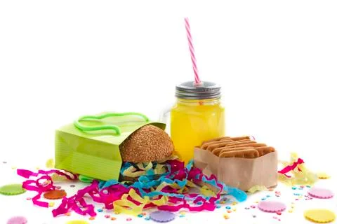 Festive composition drinks snacks holiday hamburger cookie tinsel confetti gi Stock Photos