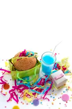 Festive composition drinks snacks holiday hamburger cookie tinsel confetti gi Stock Photos