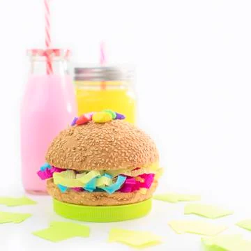 Festive composition drinks snacks holiday hamburger cookie tinsel confetti gi Stock Photos