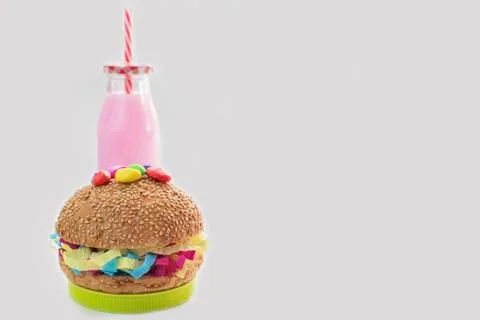 Festive composition drinks snacks holiday hamburger cookie tinsel confetti gi Stock Photos