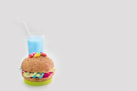 Festive composition drinks snacks holiday hamburger cookie tinsel confetti gi Stock Photos