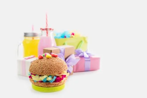 Festive composition drinks snacks holiday hamburger cookie tinsel confetti gi Stock Photos