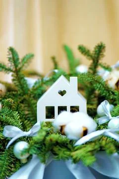 Festive composition featuring hands arranging a Christmas scene with evergree Stock Photos