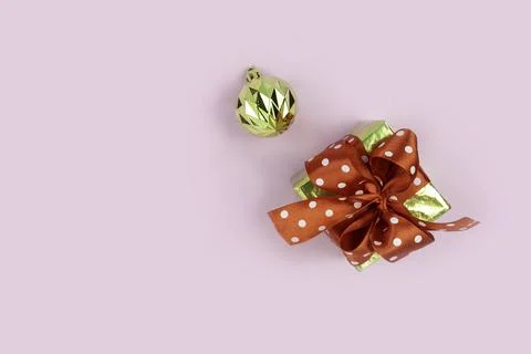 Festive composition. Gift box and golden balls.flat lay,Copy space Stock Photos