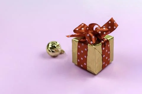 Festive composition. Gift box and golden balls.Copy space Stock Photos