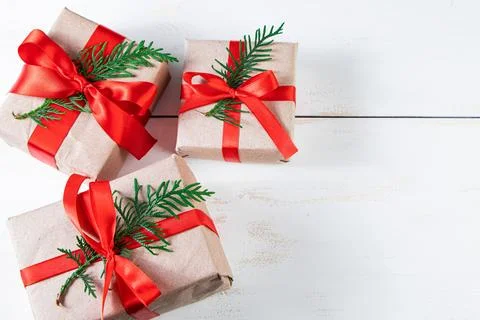 Festive composition. Gift boxes with red ribbon and Christmas balls on whit.. Stock Photos