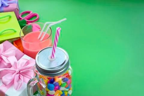 Festive composition set of gift boxes with balls candy cocktail materials. Stock Photos