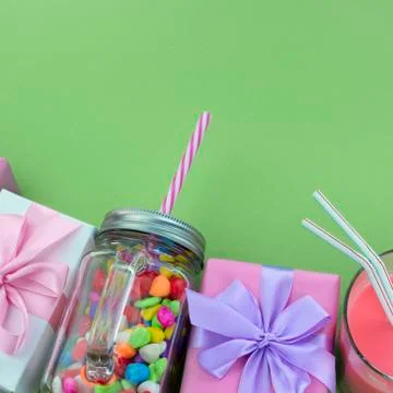 Festive composition set of gift boxes with balls candy cocktail materials. Stock Photos