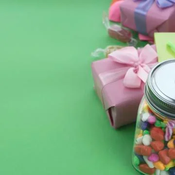 Festive composition set of gift boxes with balls candy cocktail materials. Stock Photos
